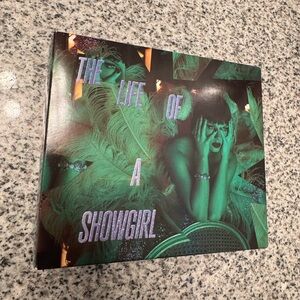 The Life of a Showgirl necklace and cd